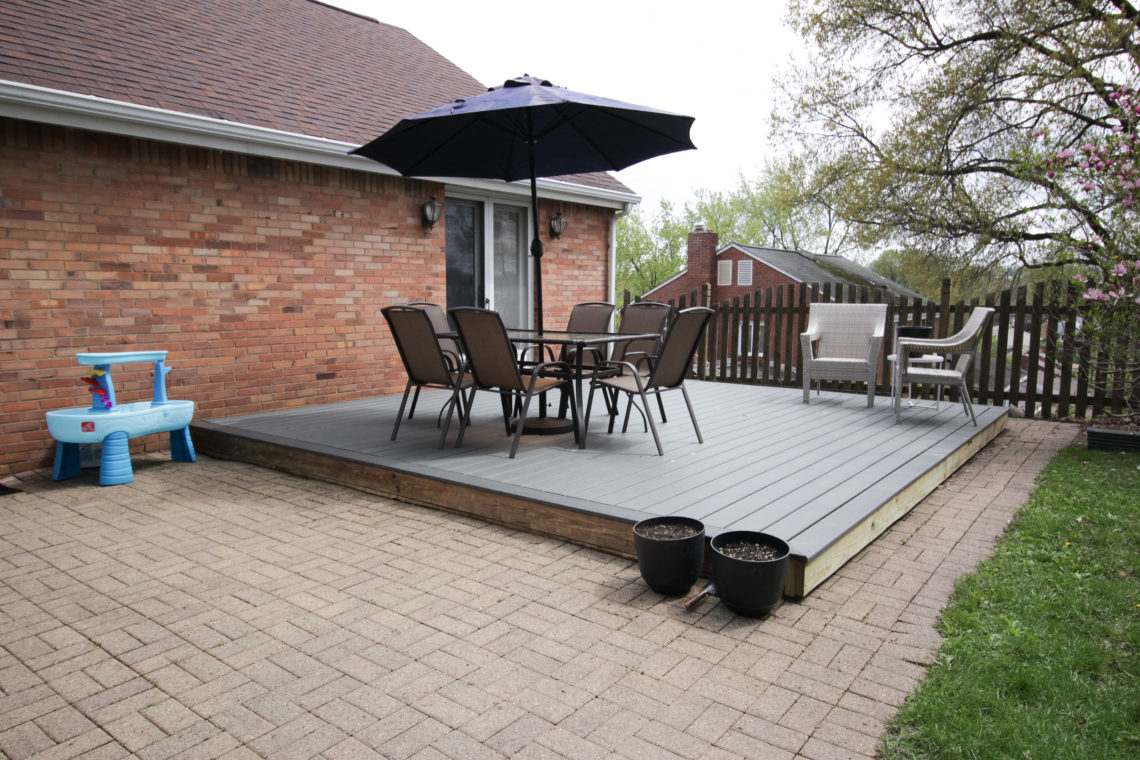 Image showing a completed deck makeover with gray horizontal deck boards and a picture frame edge.